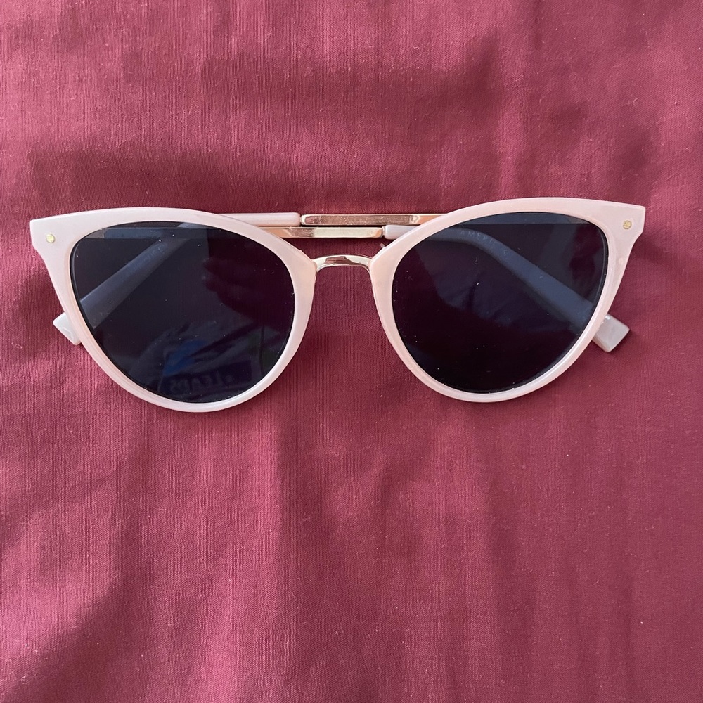 American Eagle light pink rims, blue tinted lens, cat eye sunglasses.